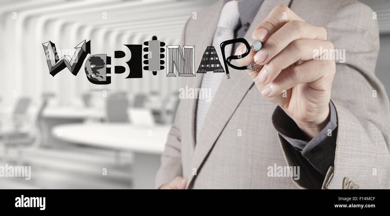 businessman hand writing Webinar graphic design word as concept Stock Photo