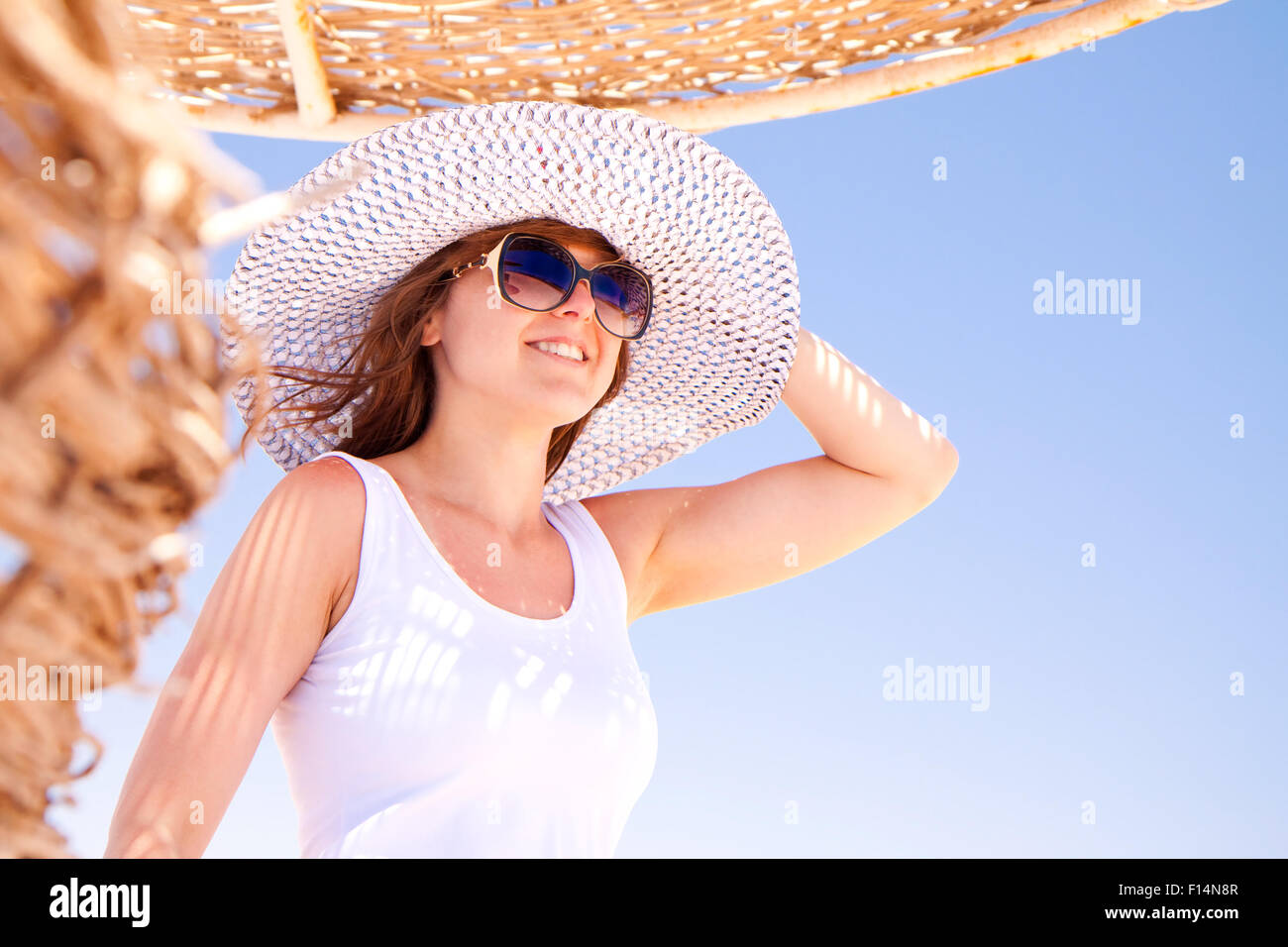 Beautiful woman in sun hat hi-res stock photography and images - Alamy