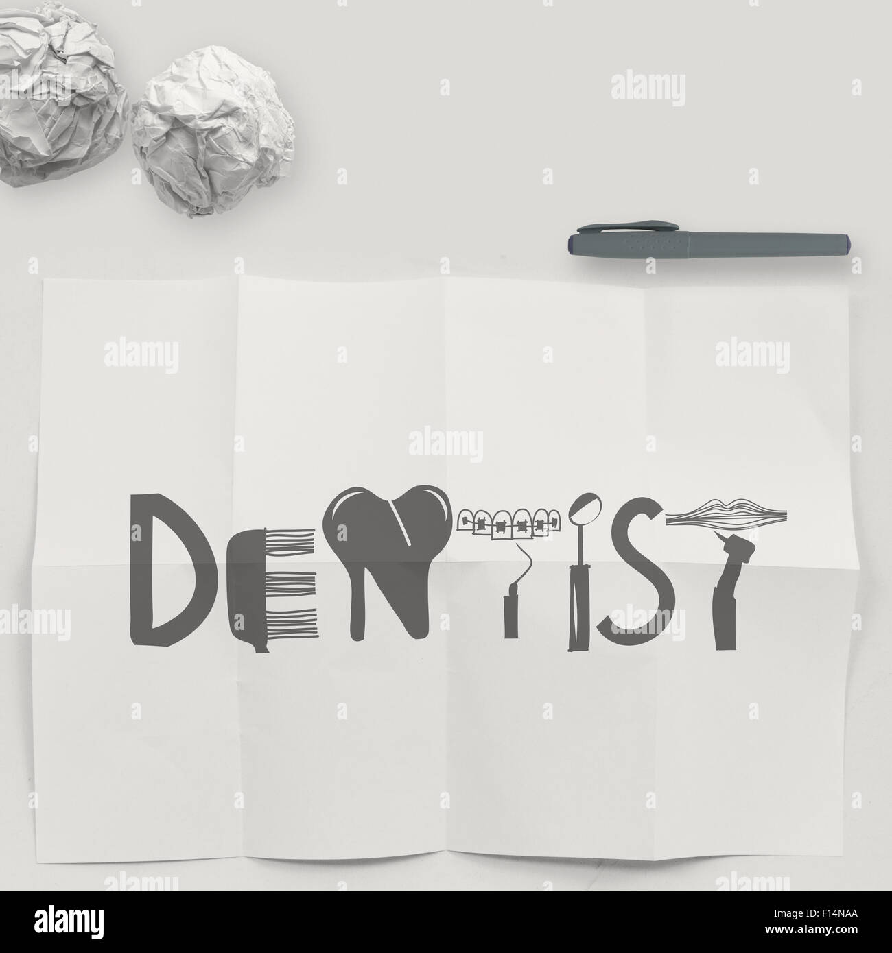 design word DENTIST on white crumpled paper and texture background as concept Stock Photo