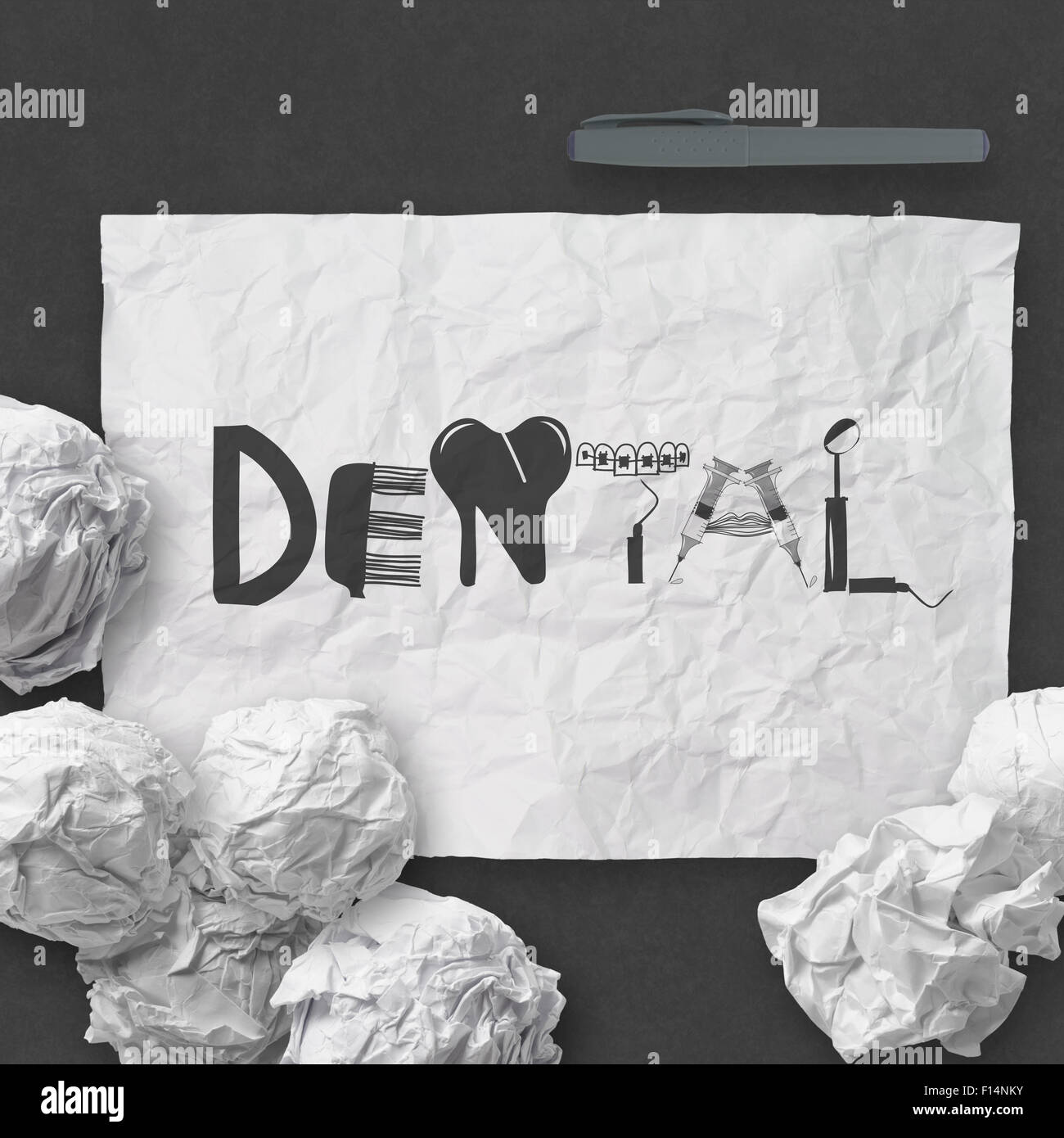design word DENTAL on white crumpled paper and texture background as concept Stock Photo