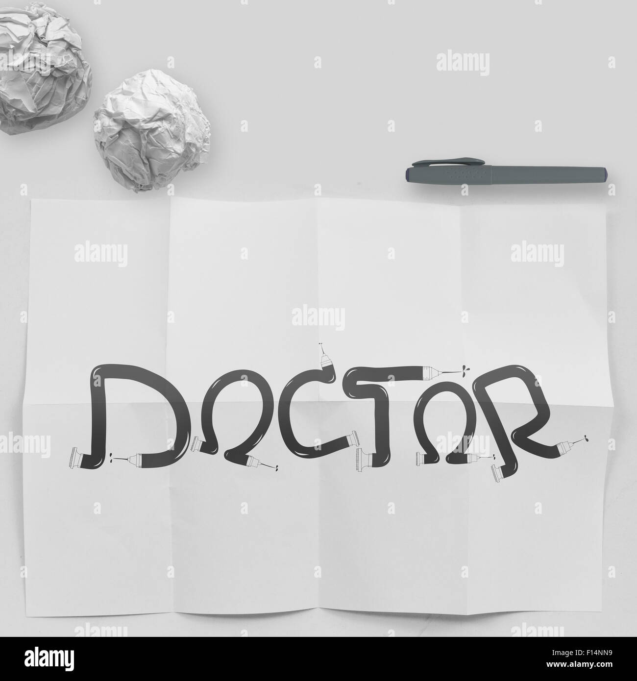 design word DOCTOR on white crumpled paper and texture background as