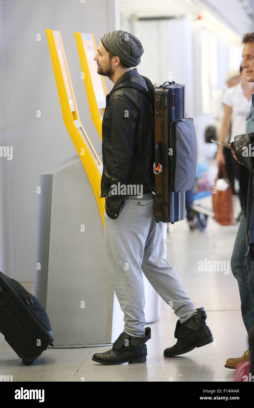 David Garrett smoking a cigarette outside at Tegel airport before