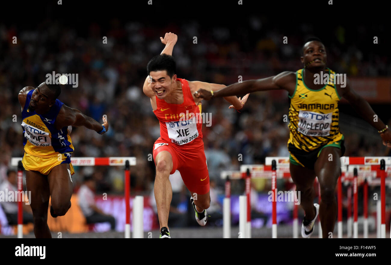 Beijing, China. 27th Aug, 2015. Xie Wenjun (C) of China crosses the ...