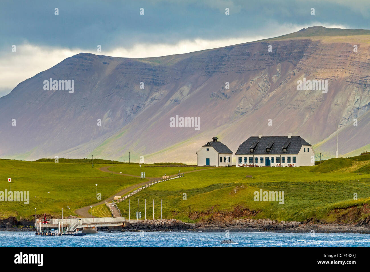 Buildings In Front Of Cliff Face Reykjavik Iceland Stock Photo
