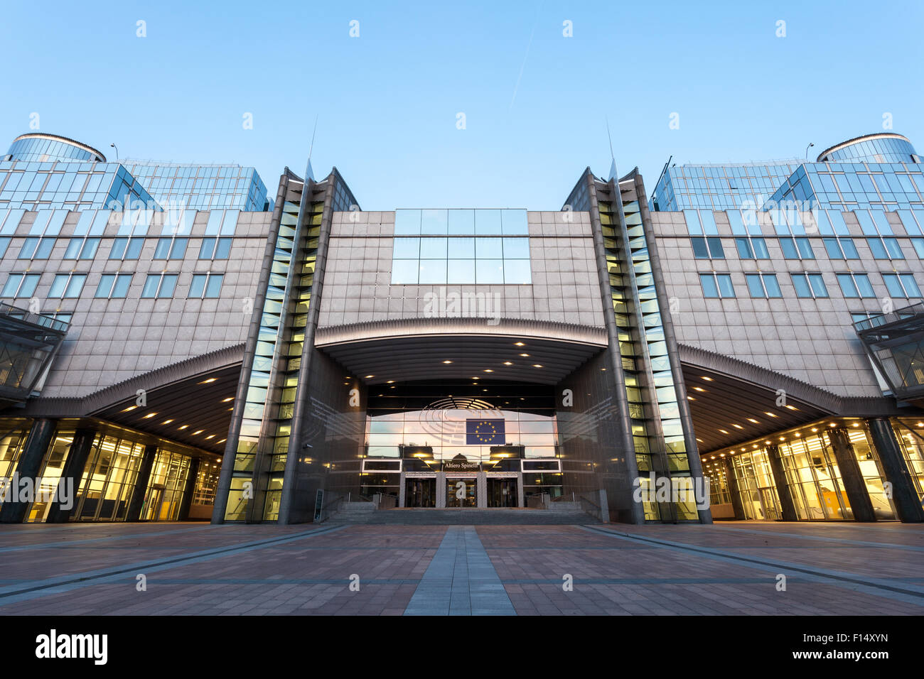 European Parliament office buildings at the Espace Leopold in Brussels illuminated at dusk. Brussels, Belgium Stock Photo
