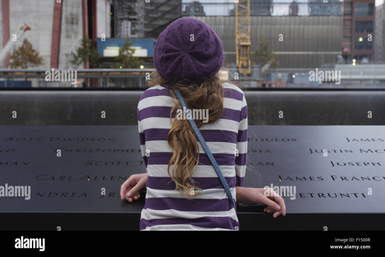 Woman viewing 911 memorial, New York City Stock Photo