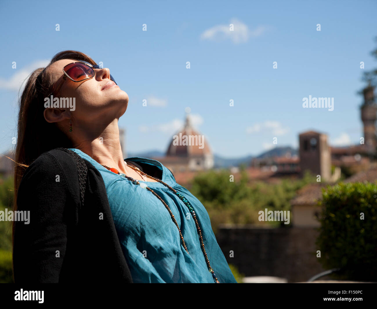 Carefree mature woman sunbathing hi-res stock photography and images ...