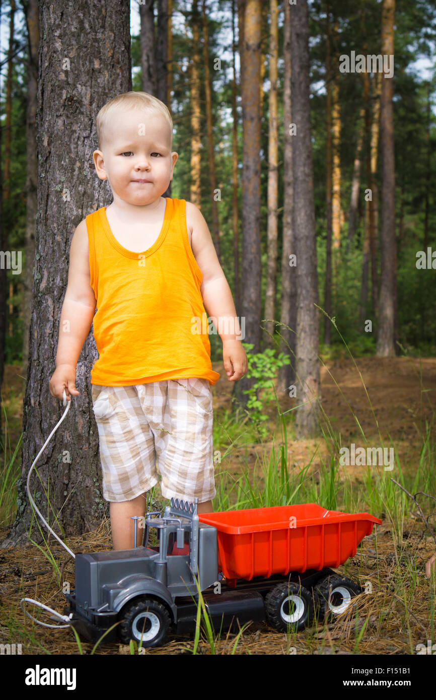 Little boy is playing toy car Stock Photo - Alamy