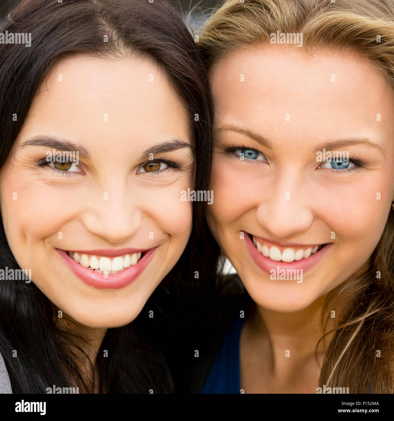 Portrait of a beautiful two young girls smiling Stock Photo
