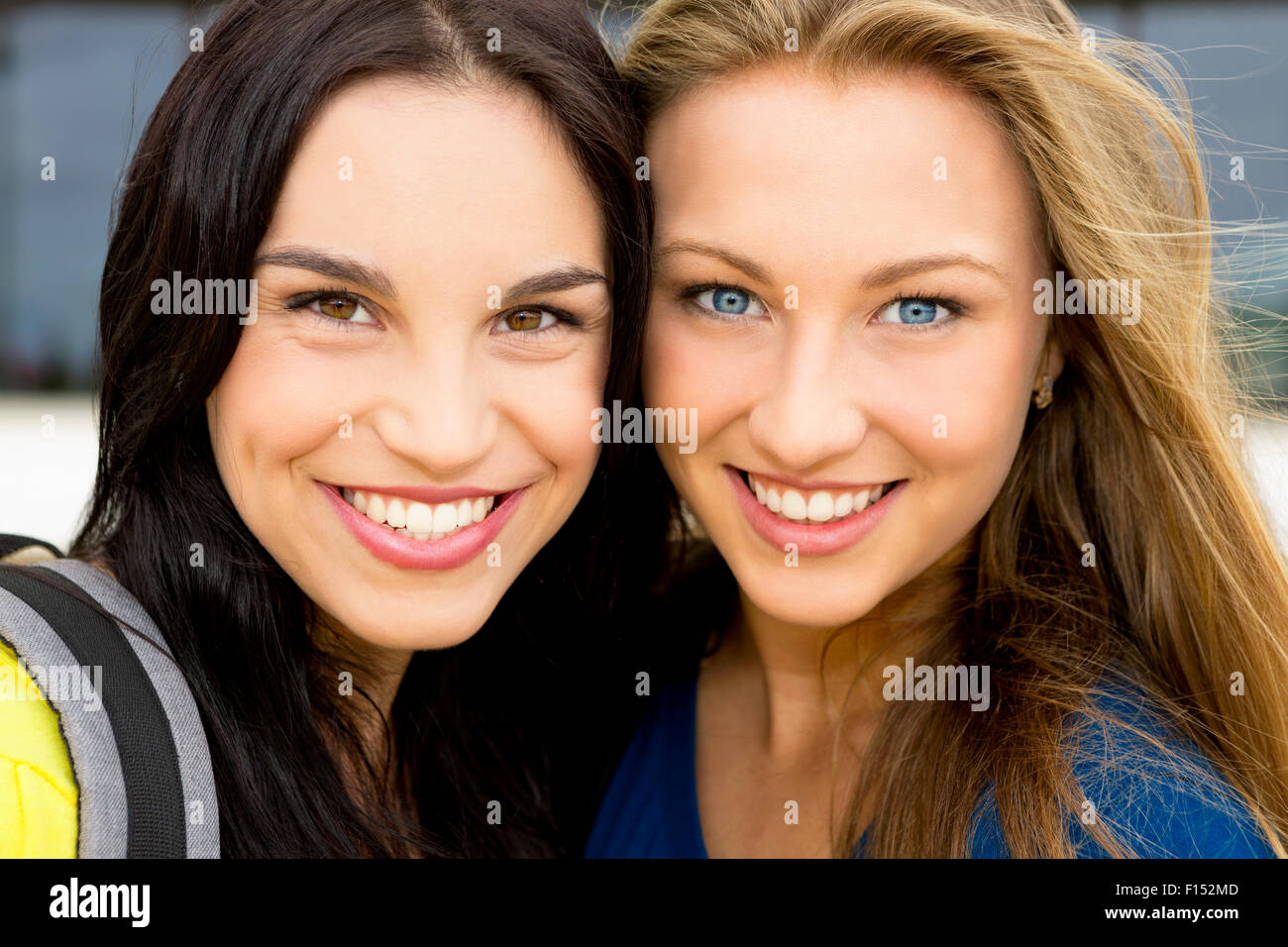 Portrait of a beautiful two young girls smiling Stock Photo - Alamy