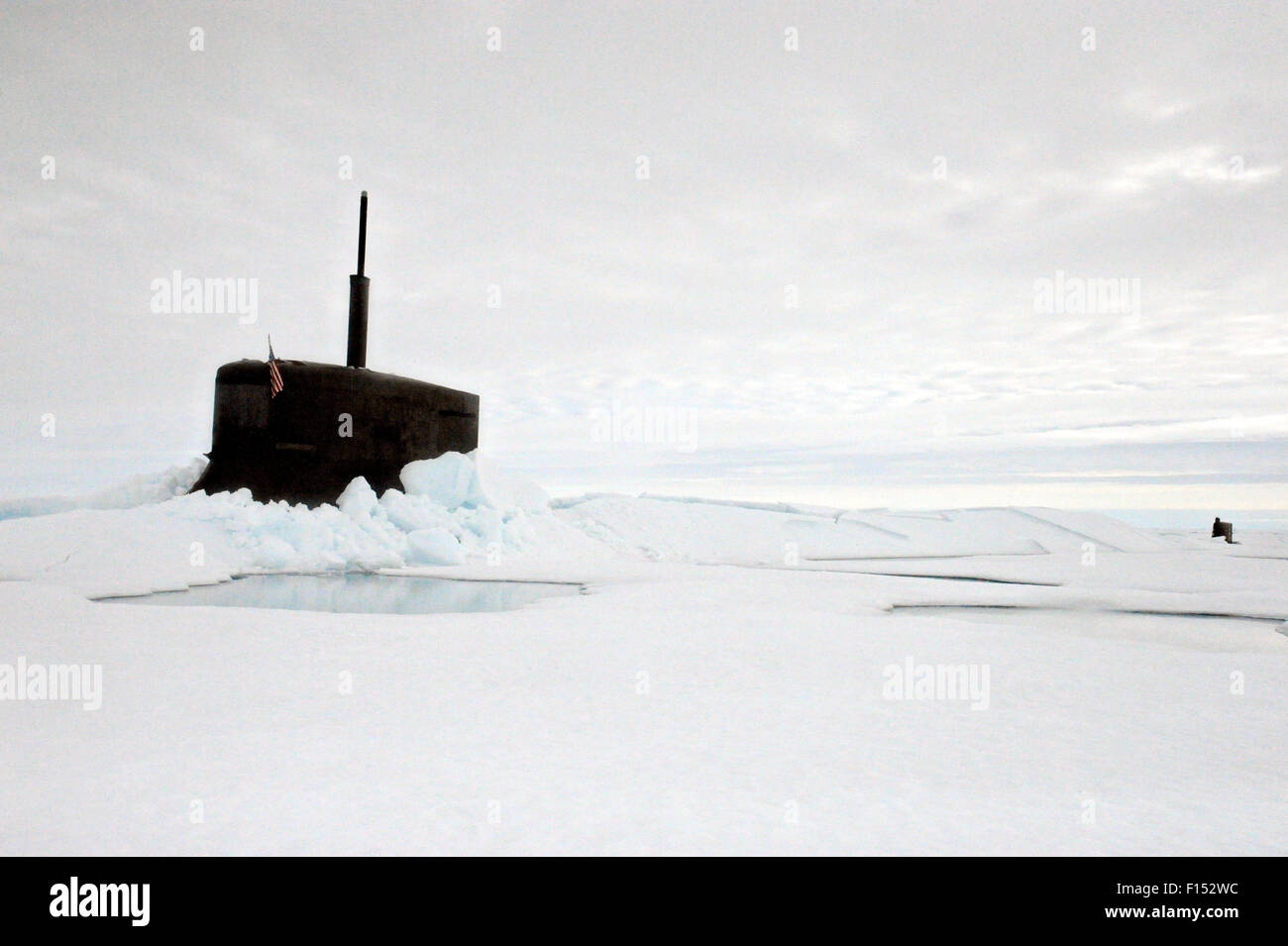 US Navy fast attack nuclear submarine USS Seawolf surfaces through arctic ice in the North Pole August 1, 2015. Stock Photo