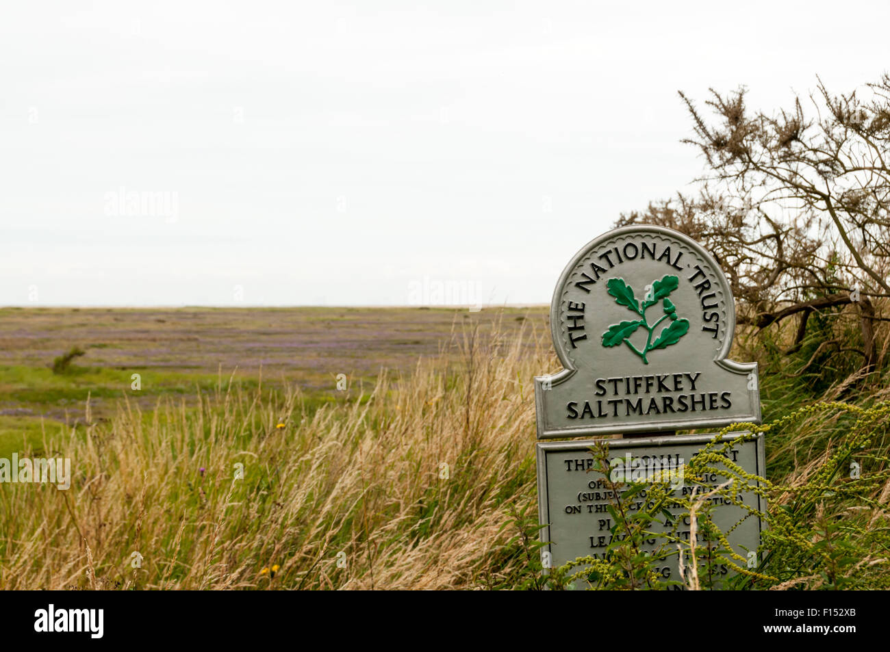 A National Trust sign for Stiffkey Saltmarshes on the North Norfolk coast. Stock Photo