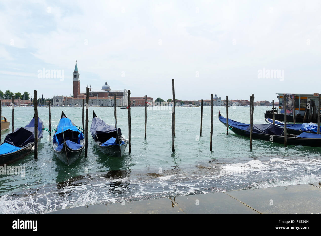 Gondolas floating at the Venetian Canal Stock Photo