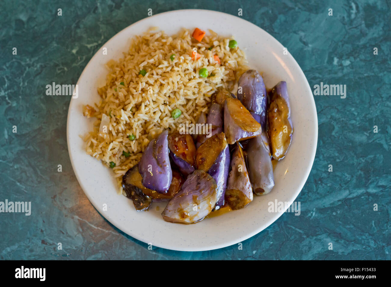 Chinese sauteed eggplant with oyster sauce and fried rice Stock Photo