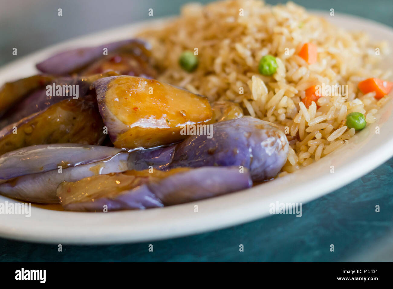 Chinese sauteed eggplant with oyster sauce and fried rice Stock Photo