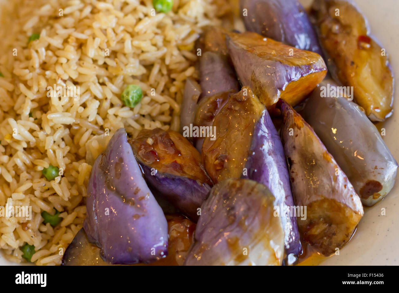 Chinese sauteed eggplant with oyster sauce and fried rice Stock Photo