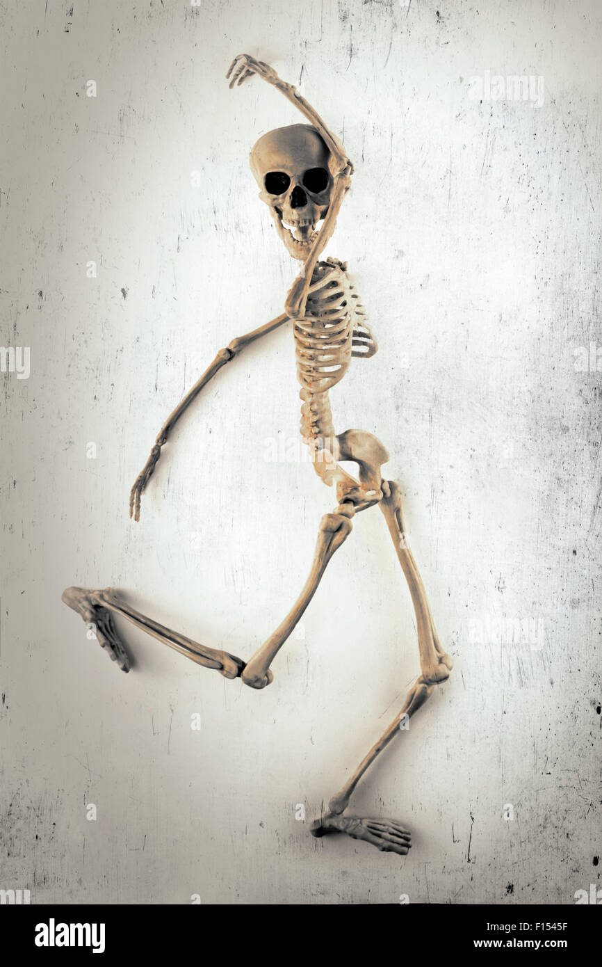 Silly dancing medical skeleton on grunge vintage background Stock Photo -  Alamy