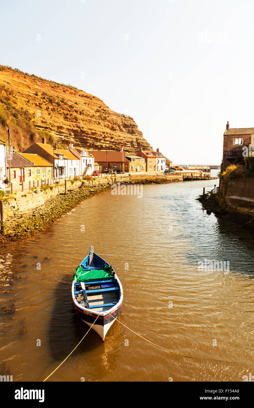 Staithes harbour village harbor bay boat in estuary town homes houses