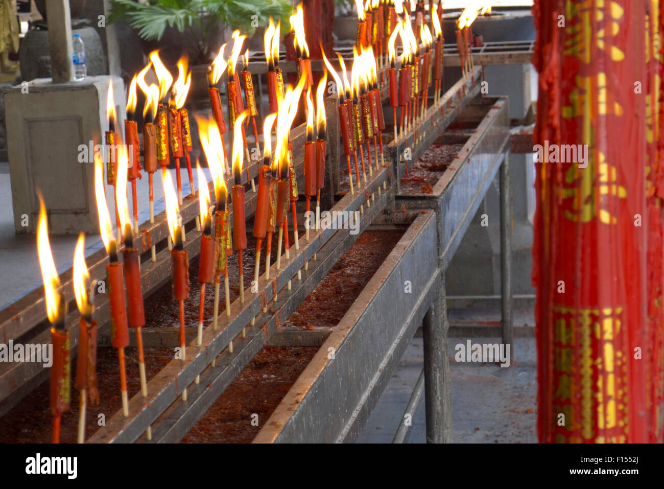 burning candles at temple Bangkok Stock Photo Alamy
