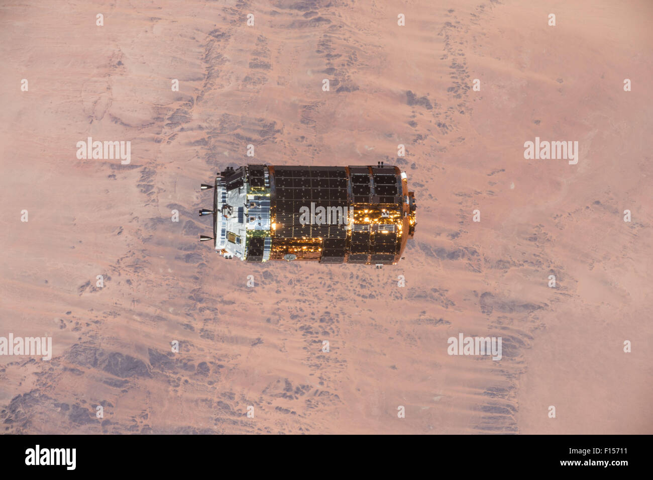 The Japan Aerospace Exploration Agency Kounotori 5 H-II Transfer Vehicle cargo spacecraft approaches the International Space Station August 24, 2015 in Earth Orbit. The automated cargo craft, named Kounotori, or white stork, carried more than four-and-a-half tons of research and supplies, including water, spare parts and experiment hardware to the ISS. Stock Photo