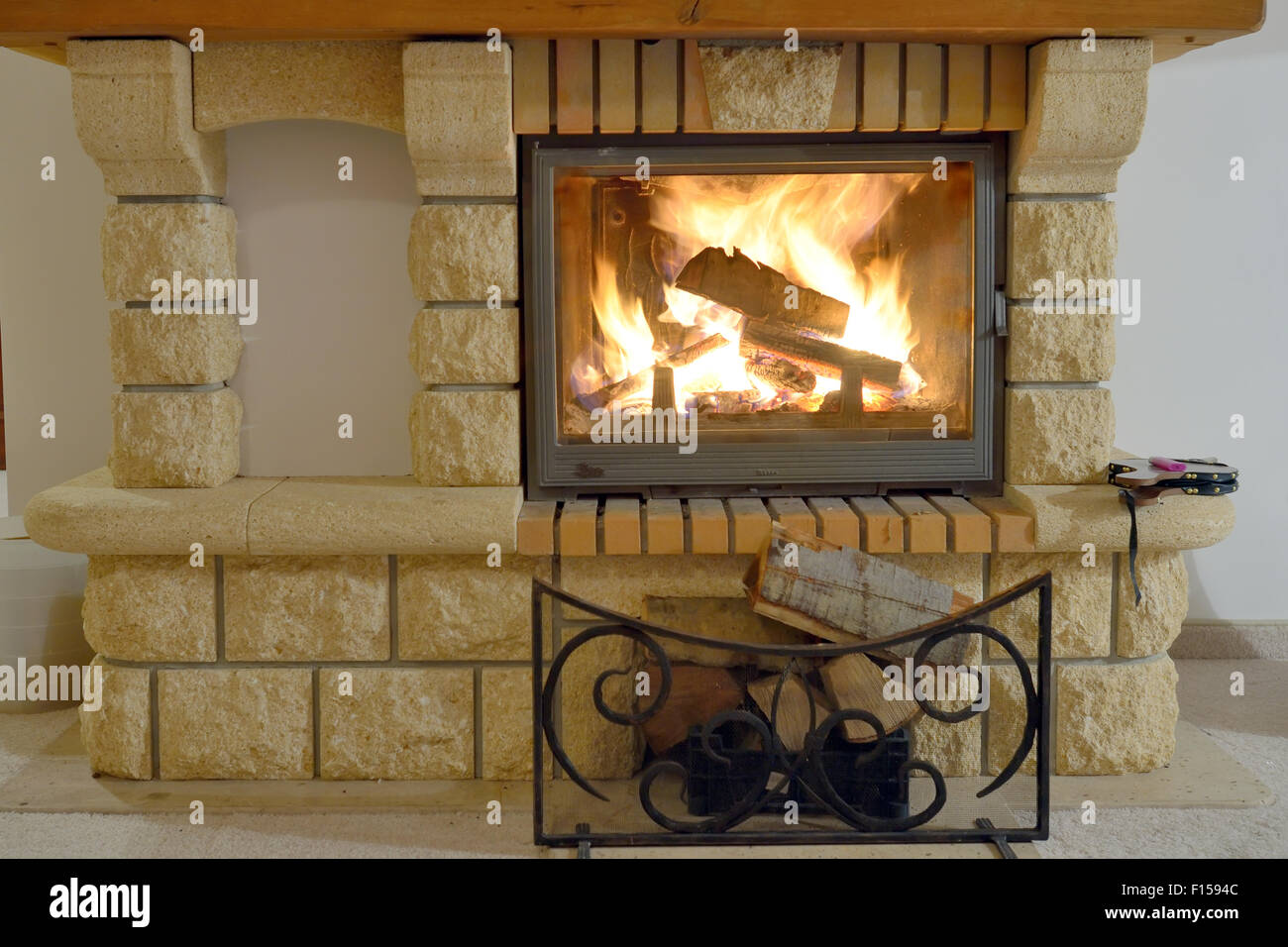 Burning Fireplace inside of hotel room Stock Photo