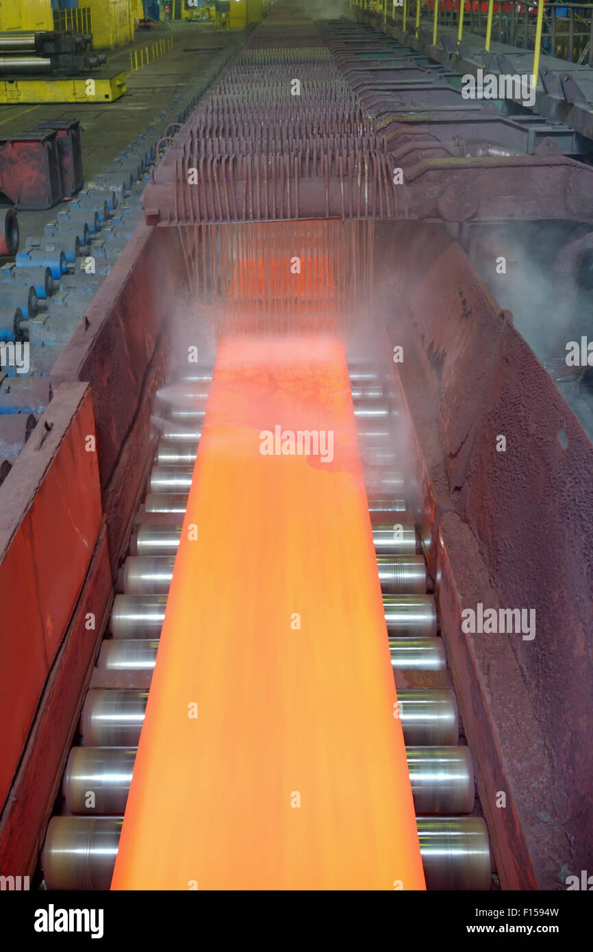 steel plate on conveyor in steel plant Stock Photo