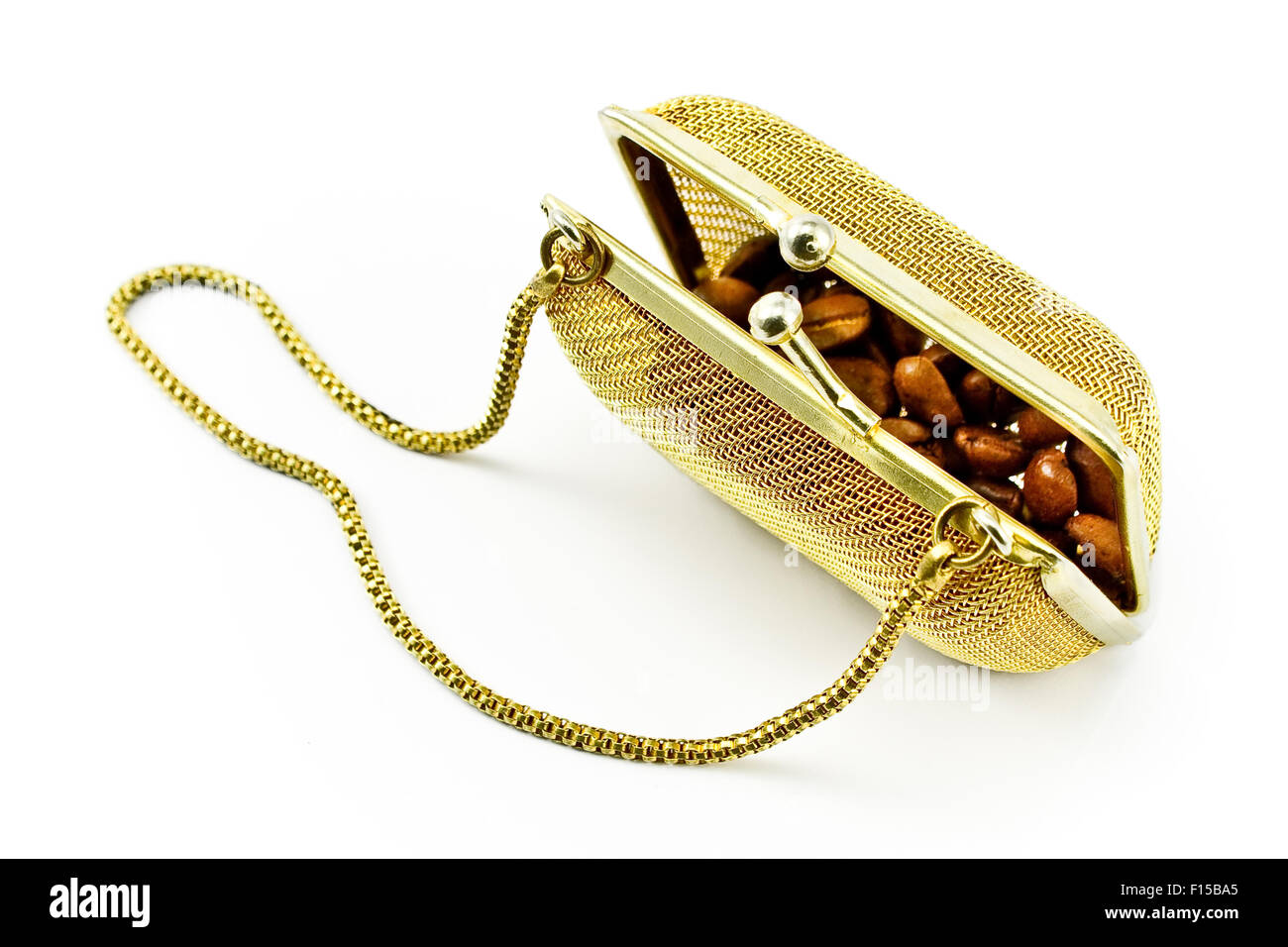 Golden metallic purse with coffee beans isolated on white Stock Photo