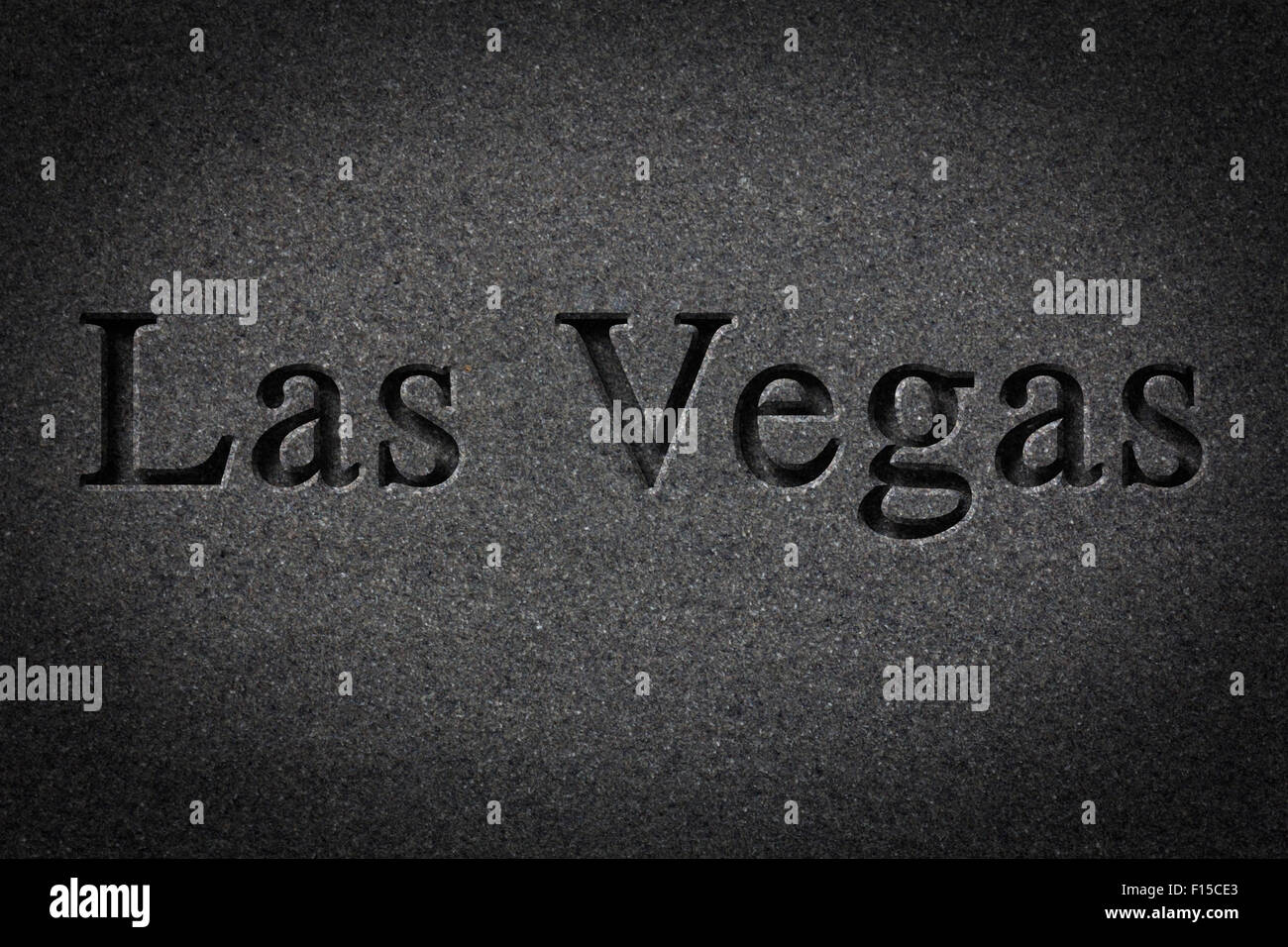 Engraving spelling the city Las Vegas on textured old surface Stock