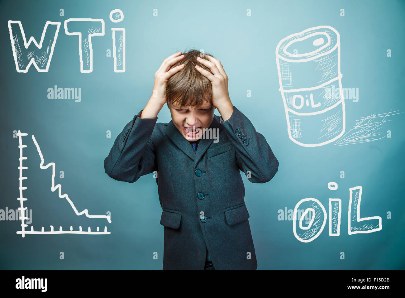 drop in the price of oil barrel WTI businessman teenager holding Stock Photo
