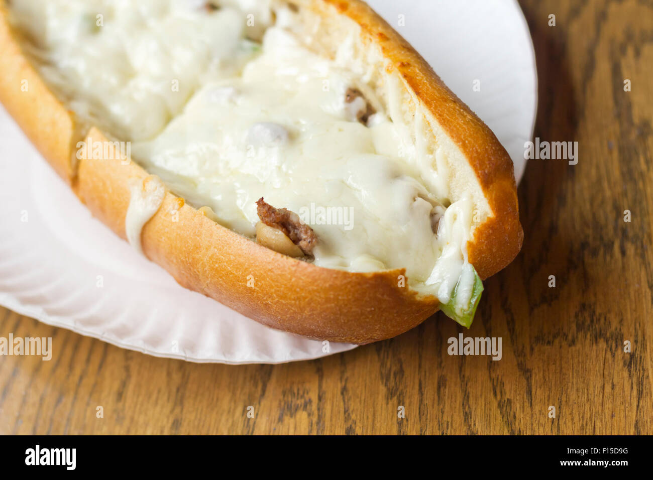 Philly Cheesesteak loaded with mozzarella cheese on submarine bun Stock