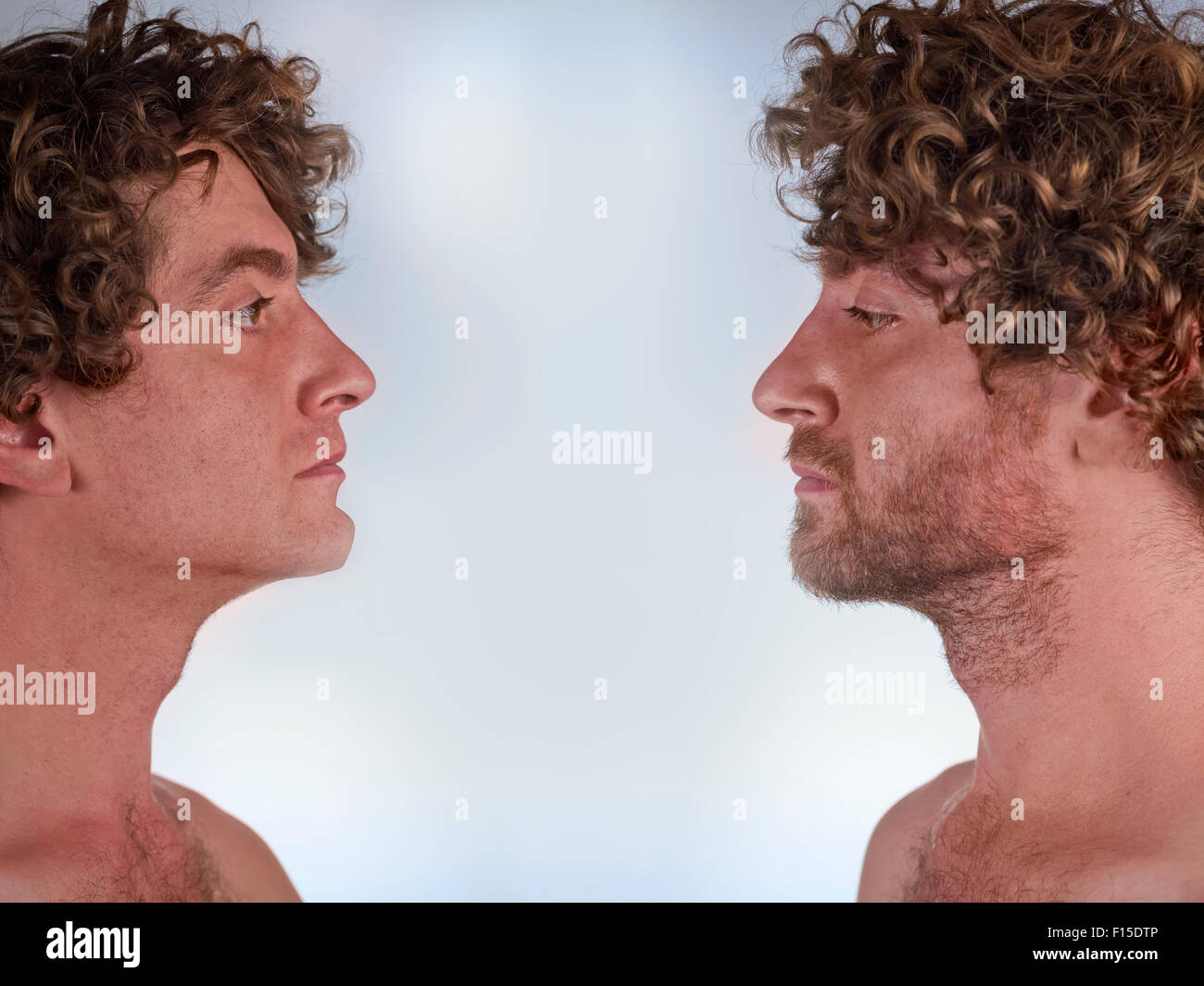Half shaved man looking at himself with and without a beard Stock Photo