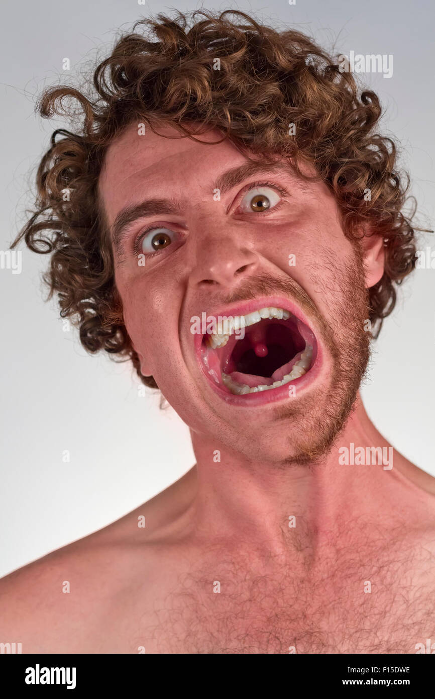 Half shaved bearded man with angry expression Stock Photo