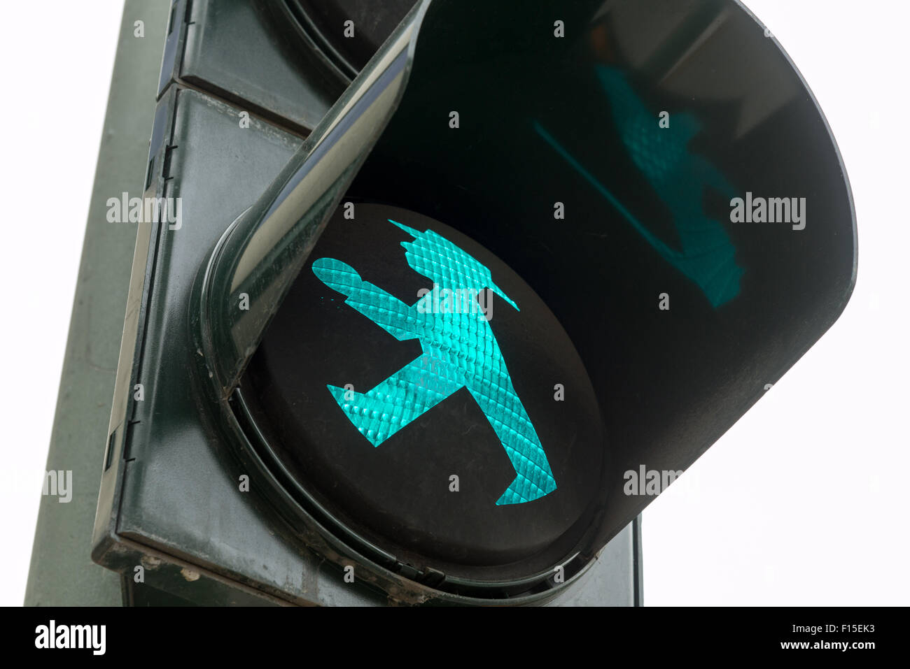 Green walk man traffic light in former East German side, Berlin, Germany Stock Photo