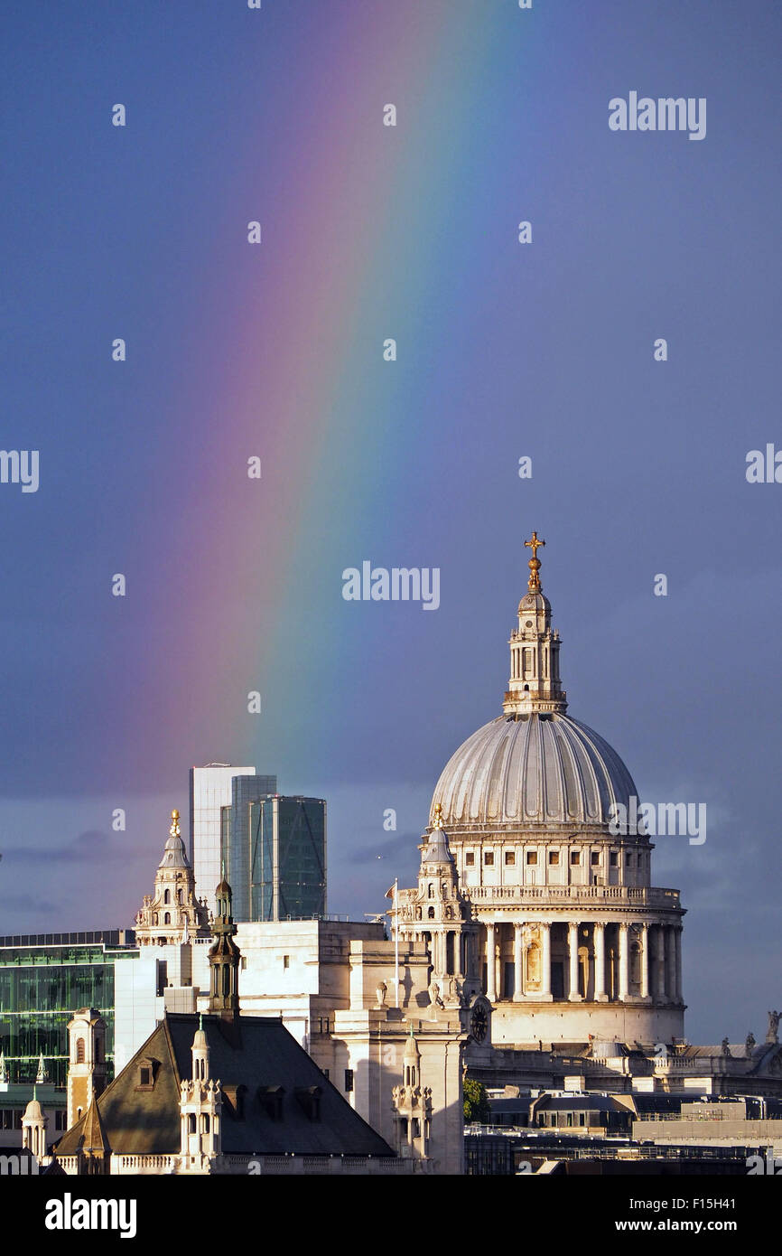 London, UK. 27th August 2015. Rainbow over St. Paul's Cathedral and the City of London, England. A shower of rain just before sunset produced a beautiful rainbow stretching across the River Thames and the City of London including St. Paul's Cathedral. Stock Photo