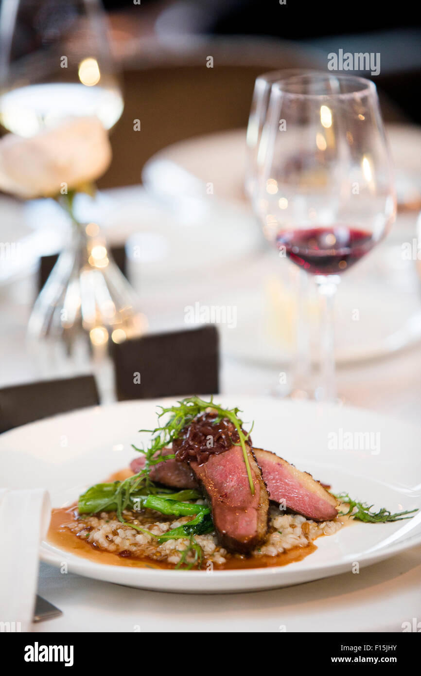 Beef with Arugula and Asparagus on Barley at Wedding Reception Stock Photo
