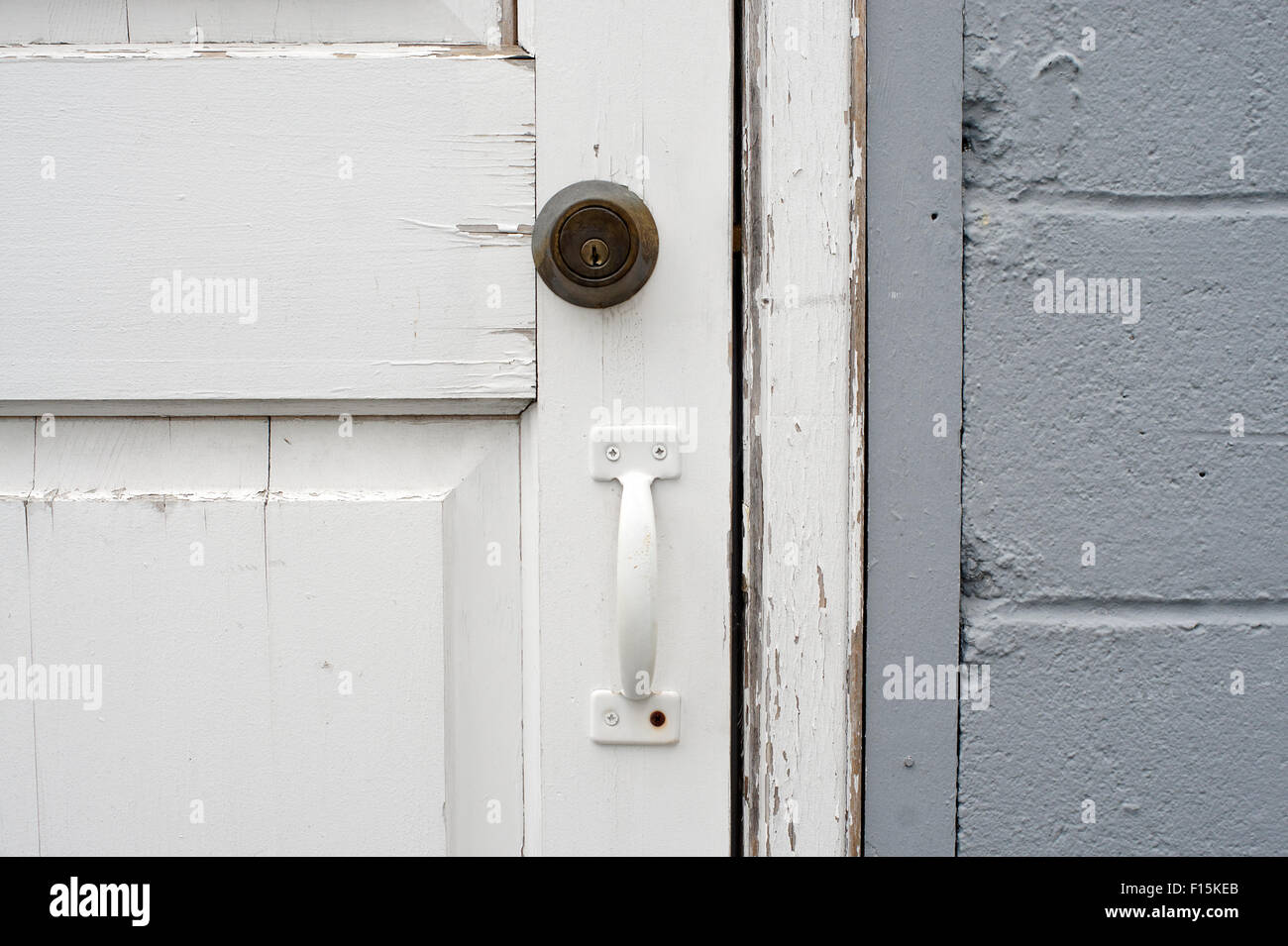 White wooden locked door with lock and metal handle Stock Photo - Alamy