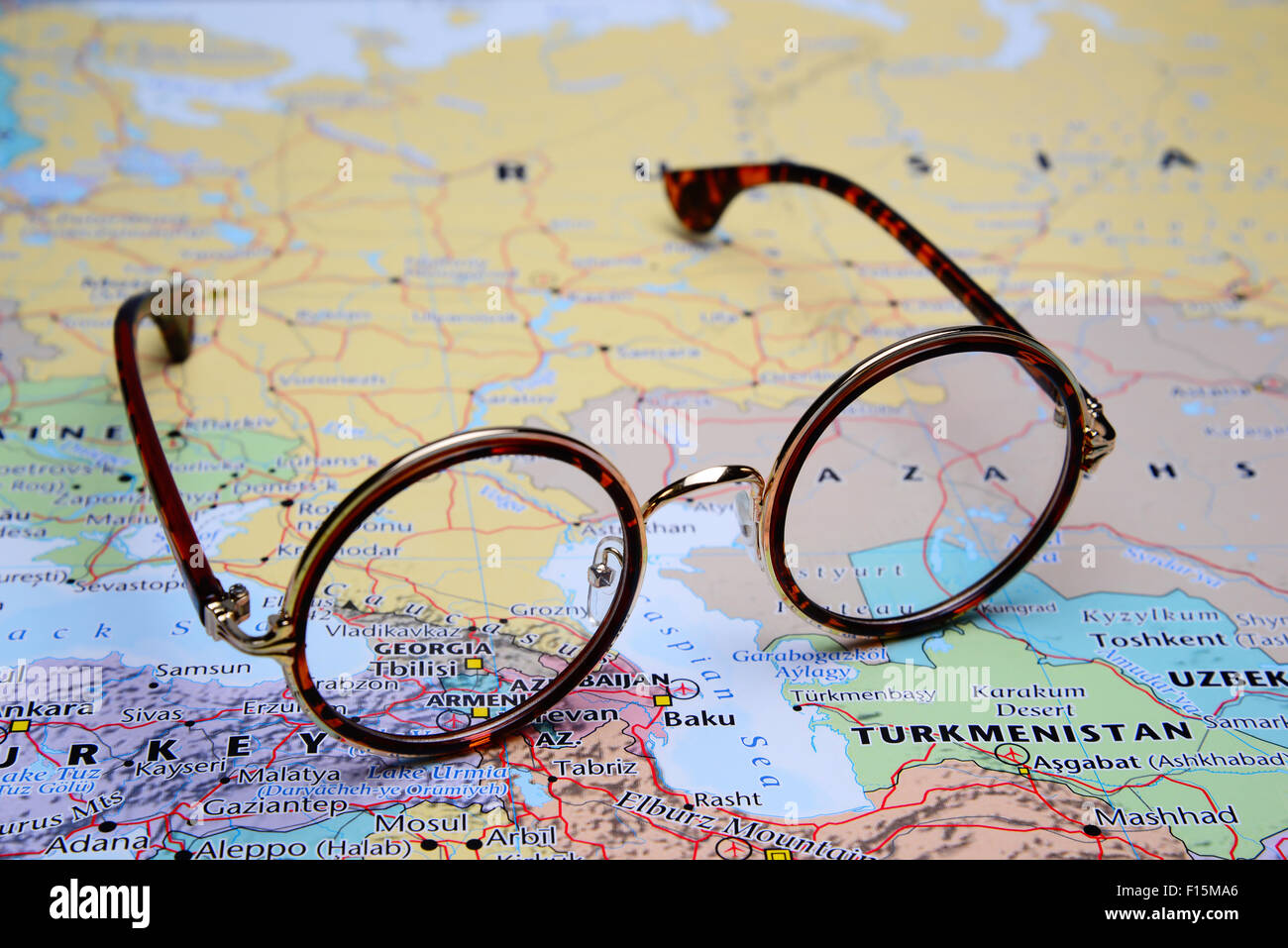 Glasses on a map of Asia - Georgia Stock Photo