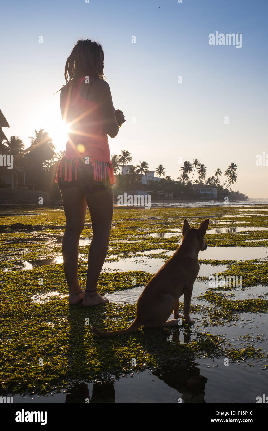 Trendy Hipster Girl with her Dog on Urban Background Stock Photo - Alamy