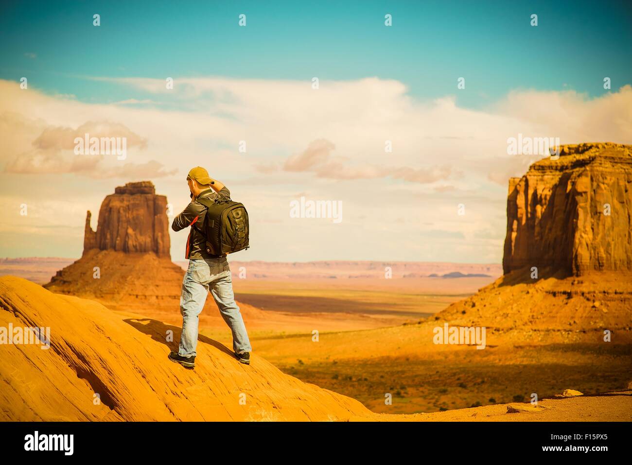 Travel Photographer at Work. Arizona Monuments Valley. Male Photographer. Stock Photo