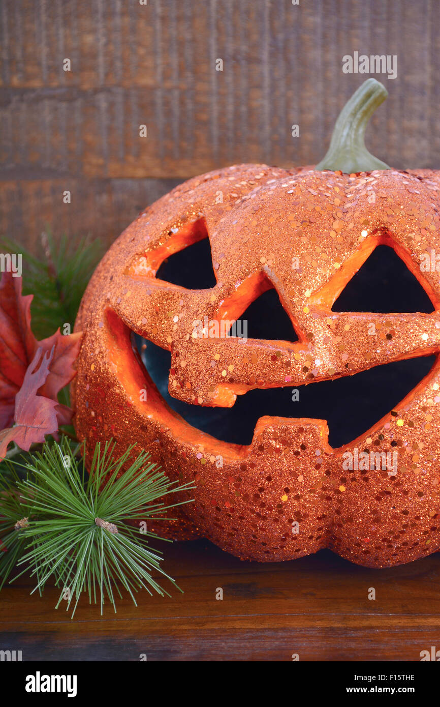 Happy Halloween table with Jack O Lantern pumpkin on rustic dark wood ...