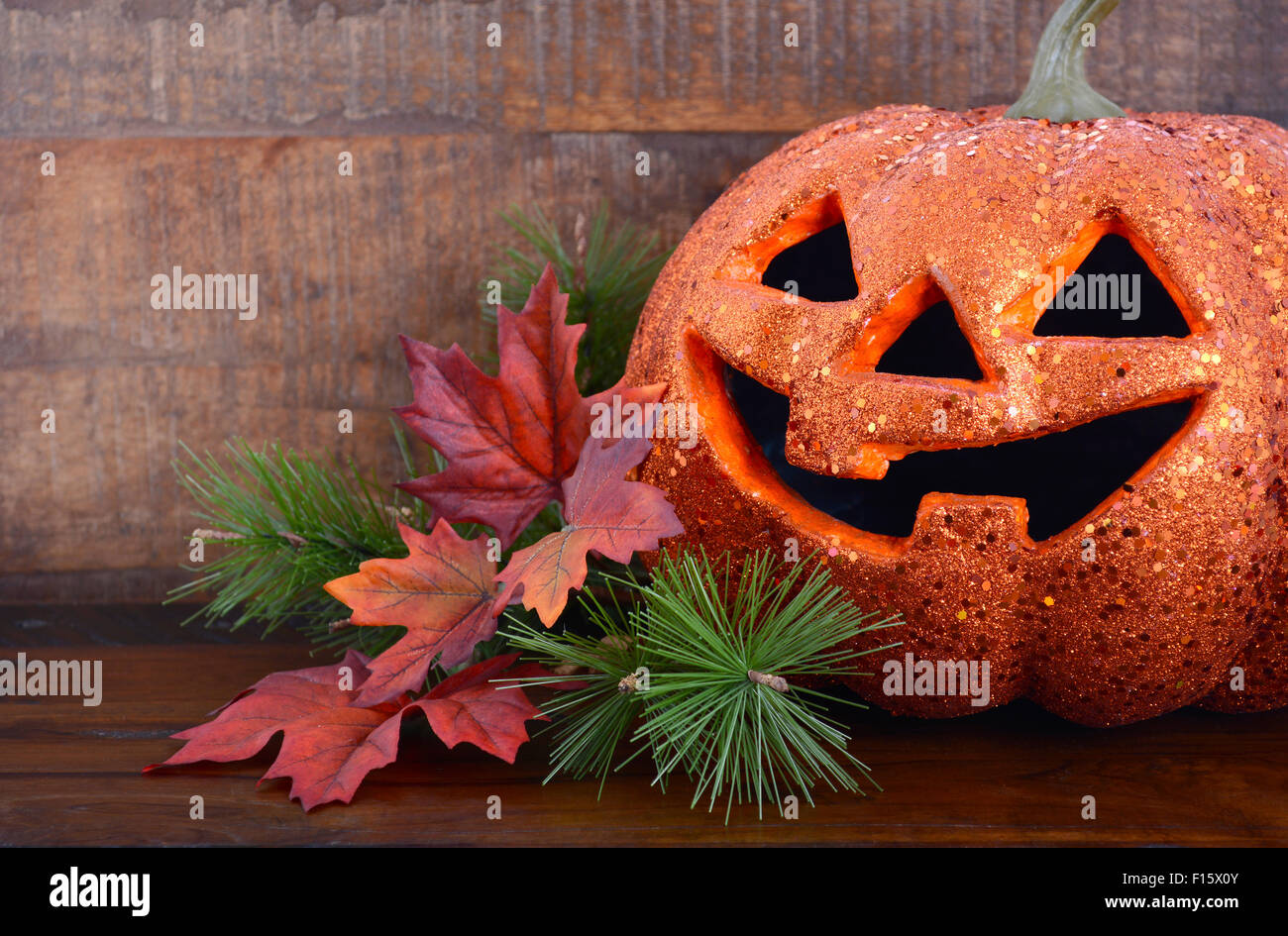 Happy Halloween table with Jack O Lantern pumpkin on rustic dark wood ...