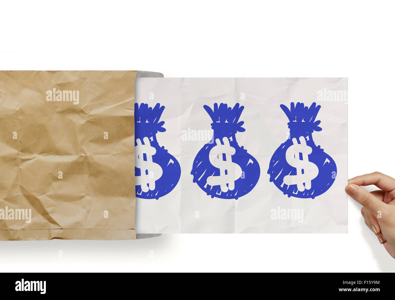 hand pull crumpled paper show dollar sign bag out of recycle envelope as concept Stock Photo