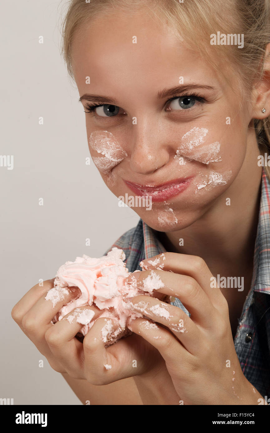 happy fun gluttonous girl eating dessert Stock Photo
