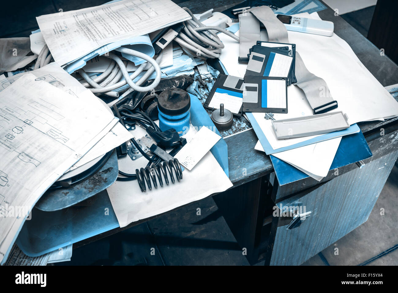 Messy workplace with stack of paper on table Stock Photo