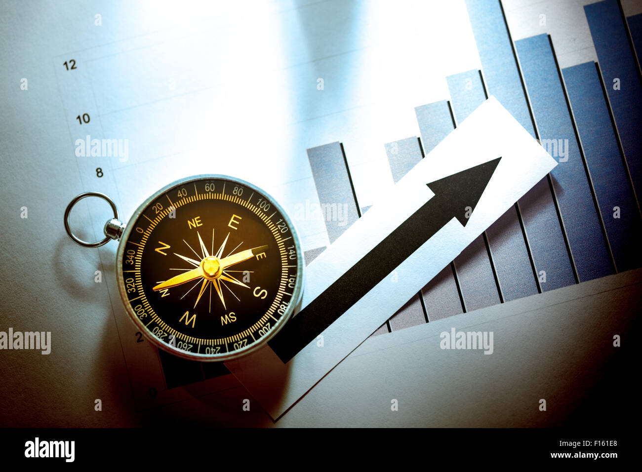 Diagram concept with compass and arrow in light Stock Photo