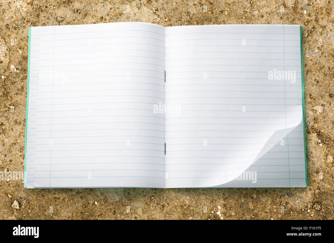 Opened blank notebook with folded left corner Stock Photo