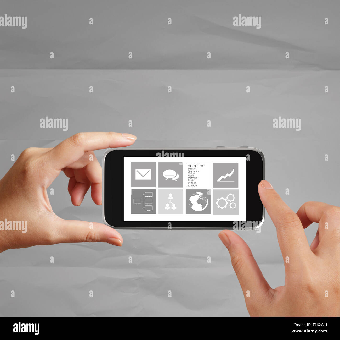 hand use Touch screen mobile phone with email icon as concept Stock Photo