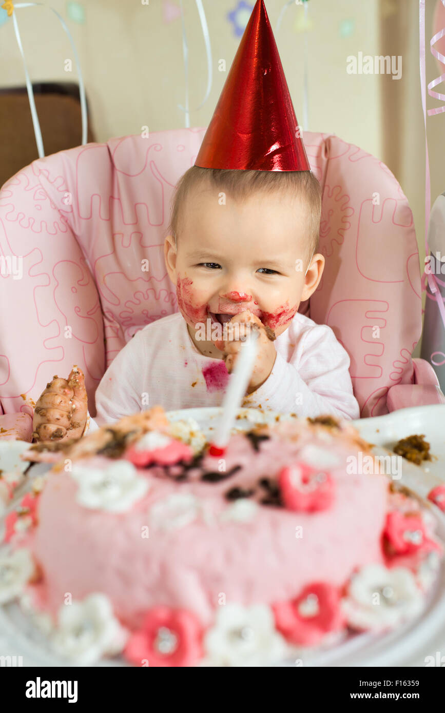 oneyearold little girl solemnize birthday, happy laughter, vertical