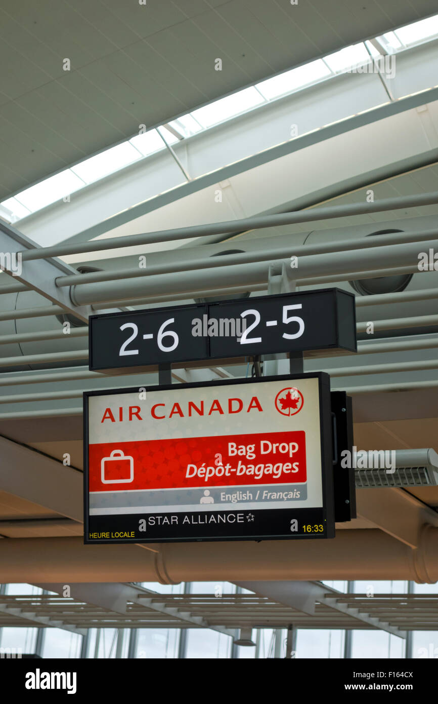 Airport baggage drop off sign for Air Canada at the Toronto Pearson International Airport Stock Photo