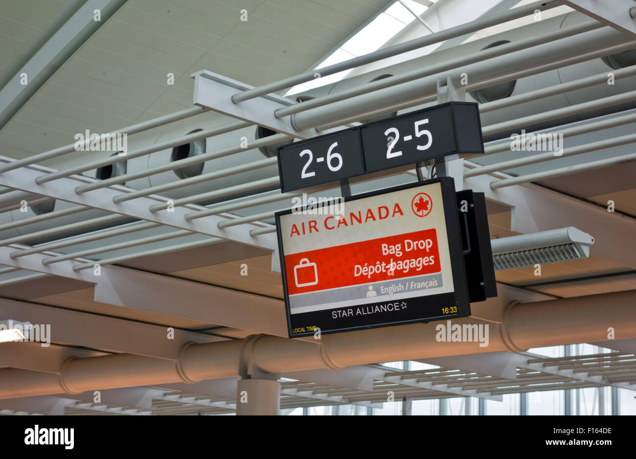 Airport baggage drop off sign for Air Canada at the Toronto Pearson International Airport Stock Photo